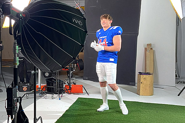 Joe smiling in the custom 'NBT Bank' uniform