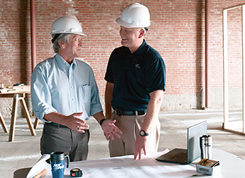 Two businessmen at construction site