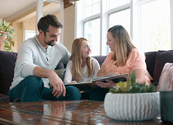 Couple with preteen daughter in home