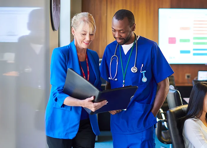 Healthcare professionals looking at patient chart