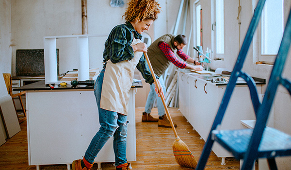 Couple working on home improvement projects inside home