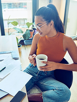 Young woman reviewing financial paperwork