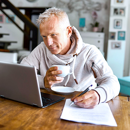 man using laptop at home