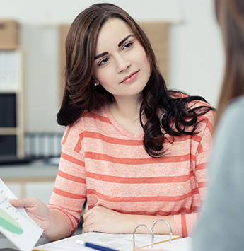 Women reviewing a report.